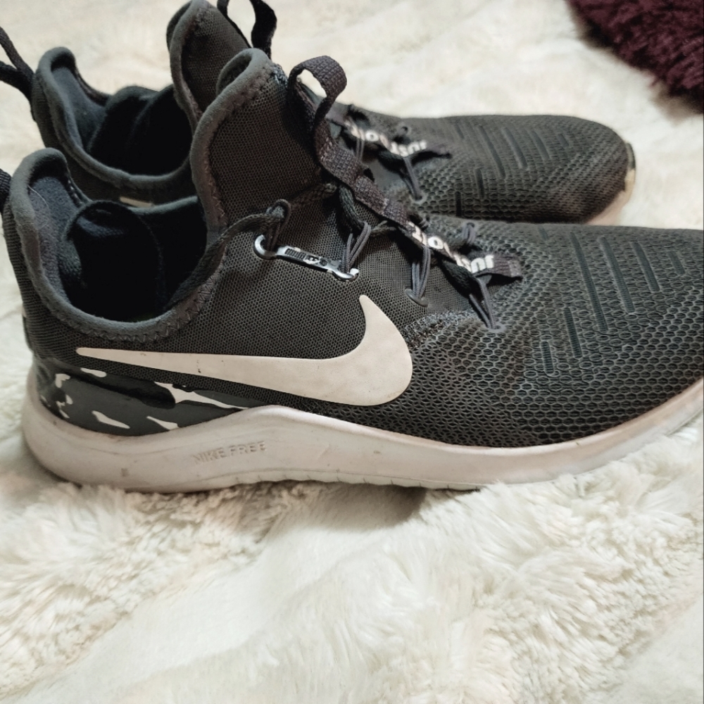 Women's Nike training shoes in gray and camouflaged detailing. Size 9.5